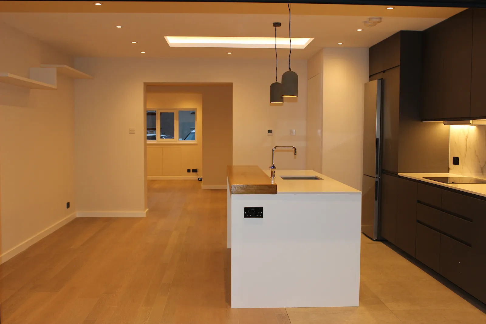 Open-plan kitchen and living space at the heart of the refurbished RM6 house