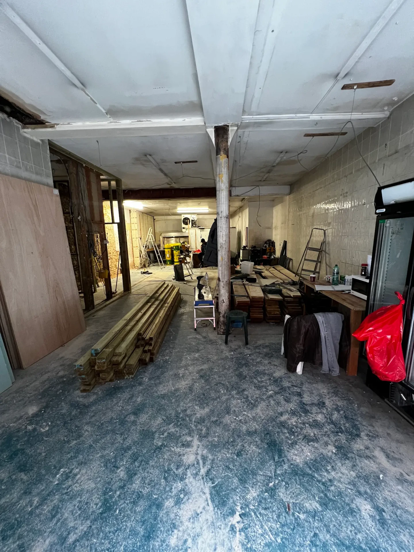 Splash & Pearl unit in E1 stripped back to shell, cluttered with tools and materials before the fit-out