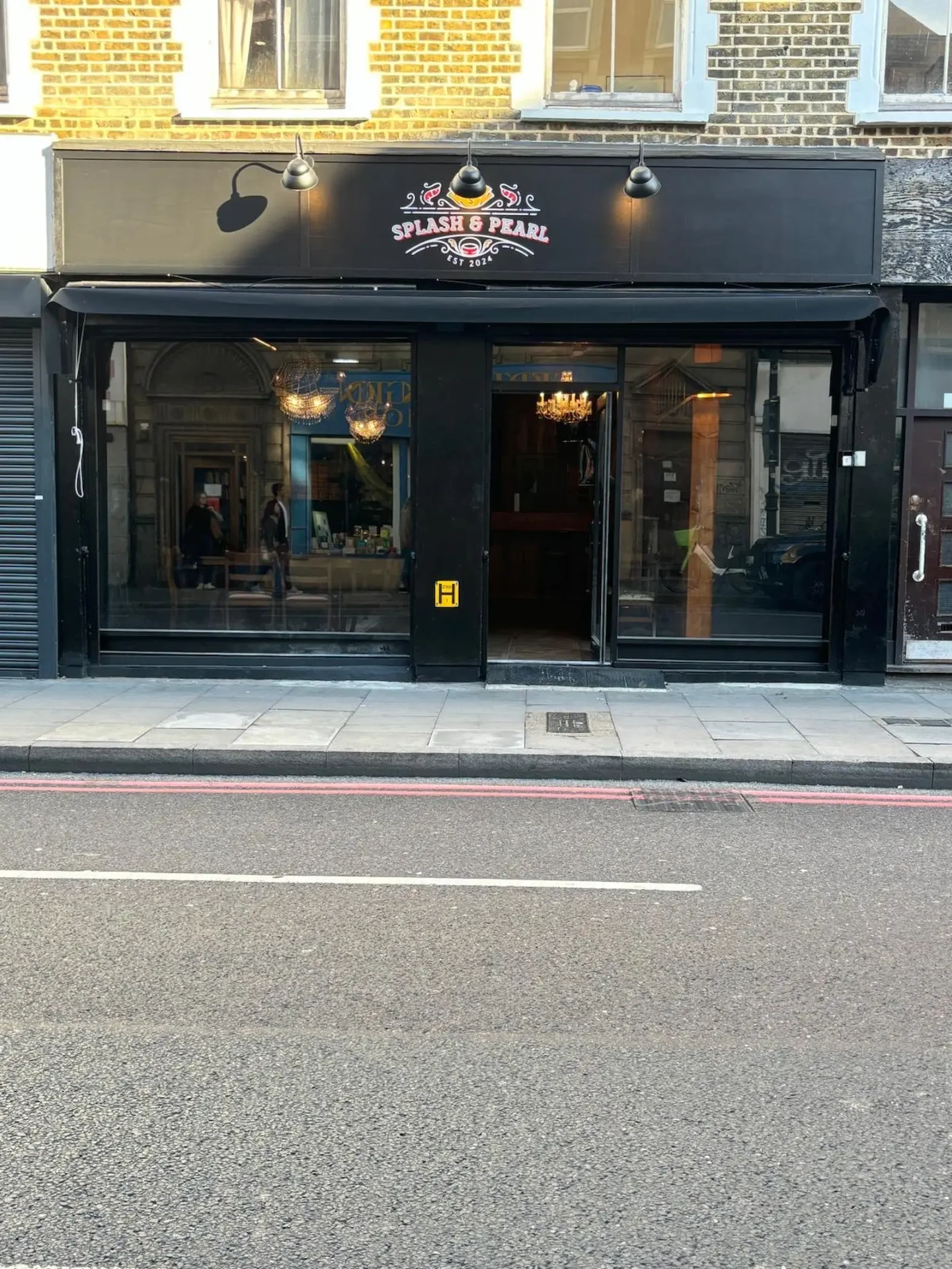 Splash & Pearl shopfront in East London with black signage and glazed frontage